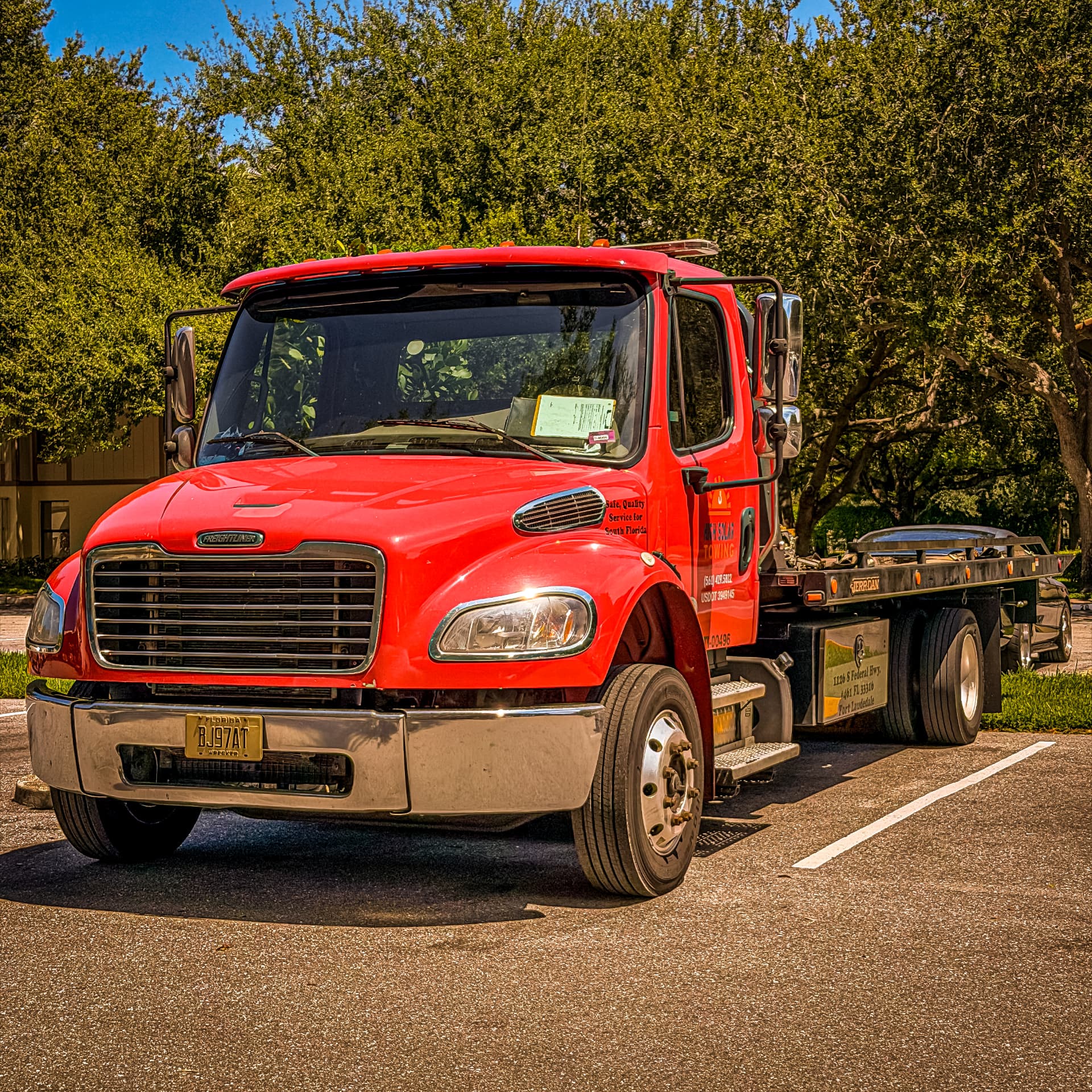 High Solar Towing red flatbed truck serving Delray Beach, FL